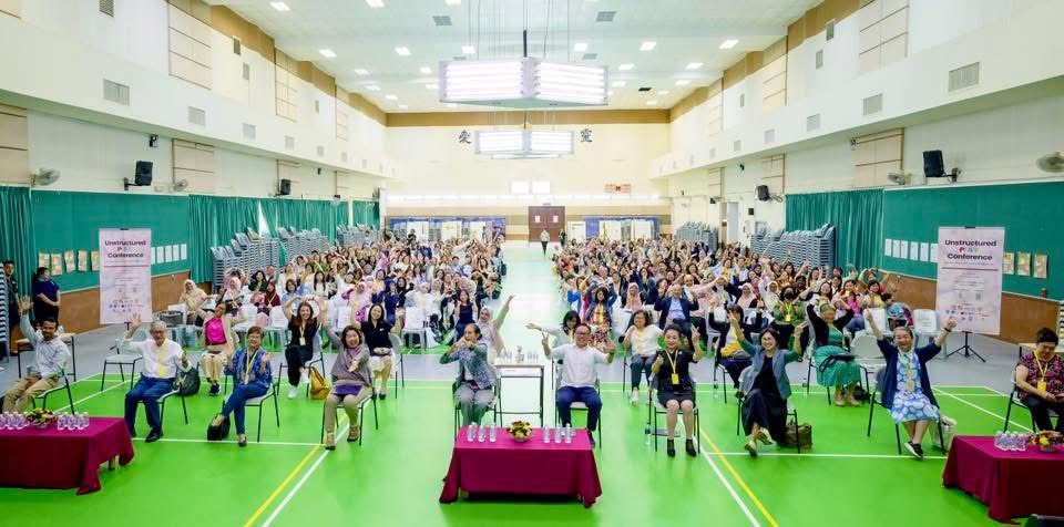 Conference and training event participants gathered in a hall